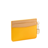 Serpenti Forever card holder in gold Urban grain calf leather. Captivating snakehead charm in light gold-plated brass embellished with red enamel eyes. SEA-CC-HOLDER-CLa image 3
