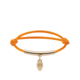 Serpenti Forever bracelet in Sahara amber light brown fabric. Gold-plated brass tubular element and captivating snakehead charm embellished with red enamel eyes. SERP-HERMINISTRING image 1