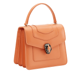 “Serpenti Forever ” top handle bag in Caramel Topaz beige calf leather finished with Deep Garnet bordeaux edges, and Beet Amethyst purple gros grain internal lining. Tempting snakehead closure in light gold plated brass enriched with Deep Garnet bordeaux and Caramel Topaz beige enamel, and seductive eyes in black onyx. 1122-CLb image 2