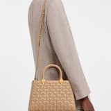 Serpentine Day Duo top handle bag in black calf leather with Calla matelassé motif and black nappa leather lining. Captivating double-head snake body-shaped handles in gold-plated brass embellished with matching calf leather inserts. SRN-001-1315M image 1