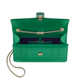 Serpenti Forever small crossbody bag in vivid emerald green calf leather with beet amethyst fuchsia grosgrain lining. Captivating snakehead magnetic closure in light gold-plated brass embellished with bright forest emerald green enamel and light gold-plated brass scales, and black onyx eyes. 422-CLc image 4