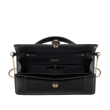 Serpenti Forever Elongated top handle bag in black calf leather with black nappa leather lining. Captivating snakehead magnetic closure in light gold-plated brass embellished with black enamel and light gold-plated brass scales, and black onyx eyes. SEA-001-1390S image 3