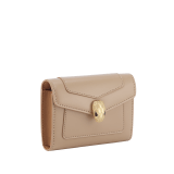 Serpenti Forever business card holder in travertine calf leather with a desert jasper nappa leather interior. Captivating snakehead press-button closure in gold-plated brass embellished with beige noisette enamel, and black enamel eyes. 295116 image 1