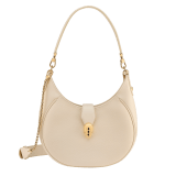 Serpenti Ellipse medium shoulder bag in Urban grain and smooth ivory opal calf leather with flamingo quartz pink grosgrain lining. Captivating snakehead closure in gold-plated brass embellished with black onyx scales and red enamel eyes. 1190-UCL image 2