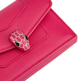 "Serpenti Forever" gusseted card holder in black calf leather. Tempting light gold-plated brass snakehead stud closure, finished with matte black enamel, and black enamel eyes. SEA-CCACCORDEON image 4