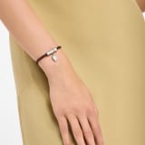Serpenti Forever bracelet in chestnut opal braided calf leather. Palladium-plated brass captivating snakehead charm attached to the front clasp closure. SERP-HER-BRAID-chestopal image 1