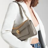 Serpenti East-West Maxi Chain medium shoulder bag in foggy opal grey Metropolitan calf leather with linen agate beige nappa leather lining. Captivating snakehead magnetic closure in gold-plated brass embellished with grey agate scales and red enamel eyes. SEA-1238-MCCL image 6