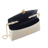 Serpenti Forever phone case in white agate varnished calf leather with black nappa leather lining. Captivating snakehead magnetic closure in gold-plated brass embellished with white agate enamel and gold-plated brass scales, and black onyx eyes. 295159 image 3
