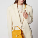 “Serpenti Forever ” top-handle bag in Lavender Amethyst lilac calf leather with Reef Coral red grosgrain inner lining. Iconic snakehead closure in light gold-plated brass embellished with black and white agate enamel and green malachite eyes. 1122-CLb image 7