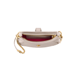 Serpenti Ellipse small crossbody bag in Urban grain and smooth ivory opal calf leather with flamingo quartz pink gros grain lining. Captivating snakehead closure in gold-plated brass embellished with black onyx scales and red enamel eyes. 1204-UCLa image 4