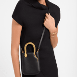 Serpentine mini tote bag in ivory opal Metropolitan calf leather with black nappa leather lining. Captivating snake body-shaped handles in gold-plated brass embellished with engraved scales and red enamel eyes. SRN-1223-CL image 1