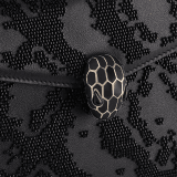 Serpenti Forever small crossbody bag in black Snake Invaders Metropolitan calf leather with a hand-sewn black glass beads embroidery and black nappa leather lining. Captivating snakehead magnetic closure in light gold-plated brass embellished with matte and shiny black enamel scales, and black onyx eyes. 292275 image 5