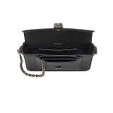 Serpenti Forever small unisex crossbody bag in matt black calf leather with black nappa leather lining and decorative chain. Captivating snakehead closure in dark ruthenium-plated brass embellished with red enamel eyes. 293022 image 4