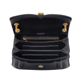 Serpenti Reverse small shoulder bag in ivory opal quilted Metropolitan calf leather with black nappa leather lining. Captivating snakehead magnetic closure in gold-plated brass embellished with red enamel eyes. 1244-MCL image 4