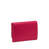 Business card holder in ruby red bright grain calf leather, desert quartz nappa and fuxia nappa lining. Iconic brass light gold plated clip featuring the BVLGARI BVLGARI motif. 579-BC-HOLDER-BGCLa image 3