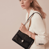 “Serpenti Diamond Blast” shoulder bag in white agate calf leather, featuring a Whispy Chain motif in light gold finishing. Iconic snakehead closure in light gold plated brass enriched with black and white agate enamel and black onyx eyes. 922-WC image 6