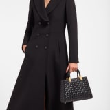 Serpentine Day Duo top handle bag in black calf leather with Calla matelassé motif and black nappa leather lining. Captivating double-head snake body-shaped handles in gold-plated brass embellished with matching calf leather inserts. SRN-001-1315M image 1