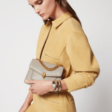 Serpenti Forever Maxi Chain small crossbody bag in foggy opal grey Metropolitan calf leather with linen agate beige nappa leather lining. Captivating snakehead magnetic closure in gold-plated brass embellished with grey agate scales and red enamel eyes. 1134-MCMC image 2
