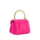 Serpenti Reverse micro top handle bag in truly tourmaline fuchsia Metropolitan calf leather with royal ruby red nappa leather lining. Captivating snakehead magnetic closure in gold-plated brass embellished with red enamel eyes. SRV-NANOREVERSE-MCL image 5