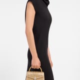 " Serpenti Pallini mini top handle bag with gold-plated brass elements embroidered on gold Liquid Metal calfskin. Captivating gold-plated brass Pallini handle and snakehead magnetic closure in gold-plated brass, embellished with full pavé zirconia and black onyx eyes." 294799 image 1