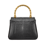Serpenti Reverse small top handle bag in soft emerald green galuchat skin with amethyst purple nappa leather lining. Captivating magnetic snakehead closure in light gold-plated brass embellished with red enamel eyes. 1234-SG image 3