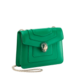 Serpenti Forever small crossbody bag in vivid emerald green calf leather with beet amethyst fuchsia grosgrain lining. Captivating snakehead magnetic closure in light gold-plated brass embellished with bright forest emerald green enamel and light gold-plated brass scales, and black onyx eyes. 422-CLe image 2