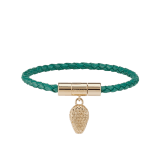 Serpenti Forever bracelet in emerald green braided calf leather. Light gold-plated brass captivating snakehead charm embellished with red enamel eyes, attached to the front clasp closure. SERP-HERBRAID-WCL-EG image 1