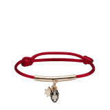 Serpenti Forever bracelet in Niagara sapphire blue fabric and light gold-plated brass tubular element. Eight-pointed star charm and captivating snakehead charm embellished with black and white agate enamel scales and black enamel eyes. SERPSTARSTRING image 1