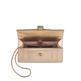 Serpenti Forever mini crossbody bag in light gold Striated calf leather with crystal rose nappa leather lining. Captivating snakehead magnetic closure in light gold-plated brass embellished with black zirconia pavé scales, and black onyx eyes. 293214 image 4