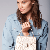 Serpenti Forever top handle bag in ivory opal laser-cut calf leather with caramel topaz beige nappa leather lining. Captivating snakehead closure in light gold-plated brass embellished with matt and shiny ivory opal enamel scales and black onyx eyes. 752-LCL image 6