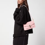 Serpenti Forever East-West small shoulder bag in primrose quartz pink calf leather with heather amethyst pink grosgrain lining. Captivating snakehead magnetic closure in light gold-plated brass embellished with black and white agate enamel scales and black onyx eyes. 1237-Cla image 5