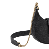 Serpenti Ellipse micro crossbody bag in moon silver black metallic karung skin with black nappa leather lining. Captivating snakehead closure in gold-plated brass embellished with red enamel eyes. SEA-MICROHOBOa image 5