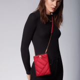 Serpenti Cabochon smart hybrid case in soft, black calf leather with maxi matelassé pattern and black nappa leather interior. Captivating, magnetic snakehead closure in gold-plated brass with red enamel eyes. SCB-HYBRID image 5