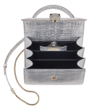 Serpenti Forever small top handle bag in white Snow Crystal crocodile skin with black nappa leather lining. Captivating snakehead press-stud closure in light gold-plated brass embellished with matte silver enamel scales and black onyx eyes. 292926 image 4