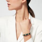 Serpenti Forever bracelet in forest emerald green calf leather. Multiple captivating snakehead rivets in light gold-plated brass embellished with red enamel eyes, and hook-and-eye closure. SER-MULTIHEADS-MCL-FE image 1