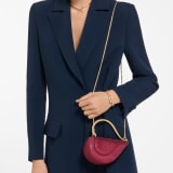 Serpenti Cuoricino mini top handle bag with gold Neige Pavé Crystals applied on a suede base and bright Travertino nappa leather lining. Captivating snake body-shaped top handle in gold-plated brass embellished with engraved scales; press-button closure. SRN-001-1366XS-CRYS image 1