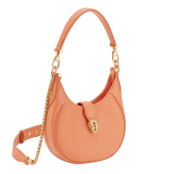 Serpenti Ellipse small crossbody bag in coral carnelian orange Urban grained calf leather with silky coral pink grosgrain lining. Captivating snakehead closure in gold-plated brass embellished with black onyx scales and red enamel eyes. 1204-UCLb image 2