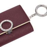 Bulgari Clip keyholder in fudge amethyst brown grain calf leather with butter onyx beige grain calf leather interior and edges, and light cream moiré lining. Iconic palladium-plated brass clip and folded closure. BCM-KEY-HOLD-CLASPa image 3