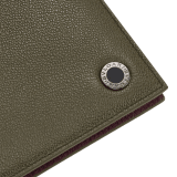 BULGARI BULGARI Man hipster compact wallet in black Urban grain calf leather with forest emerald green Urban grain calf leather interior. Iconic dark ruthenium plated-brass décor enameled in matte black, and folded closure. BBM-WLT2FASYMa image 4