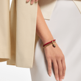 Serpenti Forever bracelet in royal ruby braided calf leather and gold-plated brass chain with magnetic clasp closure. Captivating snakehead charm embellished with black enamel, gold-plated brass scales, and black enamel eyes. SERP-BRAIDCHAIN-C image 1