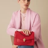 "Serpenti Forever" maxi chain crossbody bag in Amaranth Garnet red nappa leather, with Pink Spinel fuchsia nappa leather inner lining. New Serpenti head closure in gold-plated brass, finished with small red carnelian scales in the middle and red enamel eyes. 1138-MCNa image 6