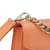 "Serpenti Forever" maxi chain pochette in Blush Quartz pink calf leather and Deep Garnet burgundy nappa leather. New Serpenti head closure in gold-plated brass, finished with red enamel eyes. SEA-XLCHAINPOUCH image 5