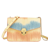 “Serpenti Forever” crossbody bag in daisy topaz full galuchat skin body and daisy topaz calf leather sides. Iconic snakehead closure in light gold plated brass enriched with black and white enamel and black onyx eyes. 1093-G image 1