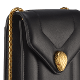 Serpenti Reverse phone case in sun citrine yellow quilted Metropolitan calf leather with linen agate beige Metropolitan calf leather interior. Captivating snakehead magnetic closure in light gold-plated brass embellished with red enamel eyes. SRV-PHONECASE image 4