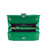 Serpenti Forever small crossbody bag in white agate calf leather with heather amethyst fuchsia grosgrain lining. Captivating snakehead closure in light gold-plated brass embellished with black and white agate enamel scales and green malachite eyes. 1082-CLb image 4