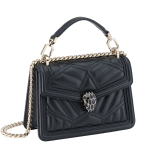 “Serpenti Diamond Blast” crossbody bag in Ivory Opal white quilted nappa leather body, featuring a maxi matelassé pattern, and black calf leather frames, with black nappa leather internal lining. Tempting snakehead closure in light gold plated brass enriched with black enamel and black onyx eyes. 1063-MFQD image 2