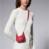 Serpenti Ellipse micro crossbody bag in soft drummed and smooth flamingo quartz pink calf leather with flamingo quartz pink gros grain lining. Captivating snakehead closure in gold-plated brass embellished with red enamel eyes. Online exclusive colour. SEA-MICROHOBOb image 6