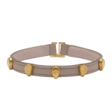 Serpenti Forever bracelet in foggy opal grey calf leather. Multiple captivating snakehead embellishments in gold-plated brass finished with red enamel eyes, and hook-and-eye closure. SER-MULTIHEADS-MCL-FO image 1