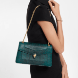 Serpenti Forever medium shoulder bag in forest emerald shiny karung with black nappa leather lining. Captivating snakehead magnetic closure in gold-plated brass embellished with forest emerald enamel and gold-plated brass scales, and black onyx eyes. 295625 image 1