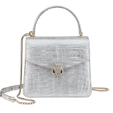 Serpenti Forever small top handle bag in white Snow Crystal crocodile skin with black nappa leather lining. Captivating snakehead press-stud closure in light gold-plated brass embellished with matte silver enamel scales and black onyx eyes. 292926 image 1
